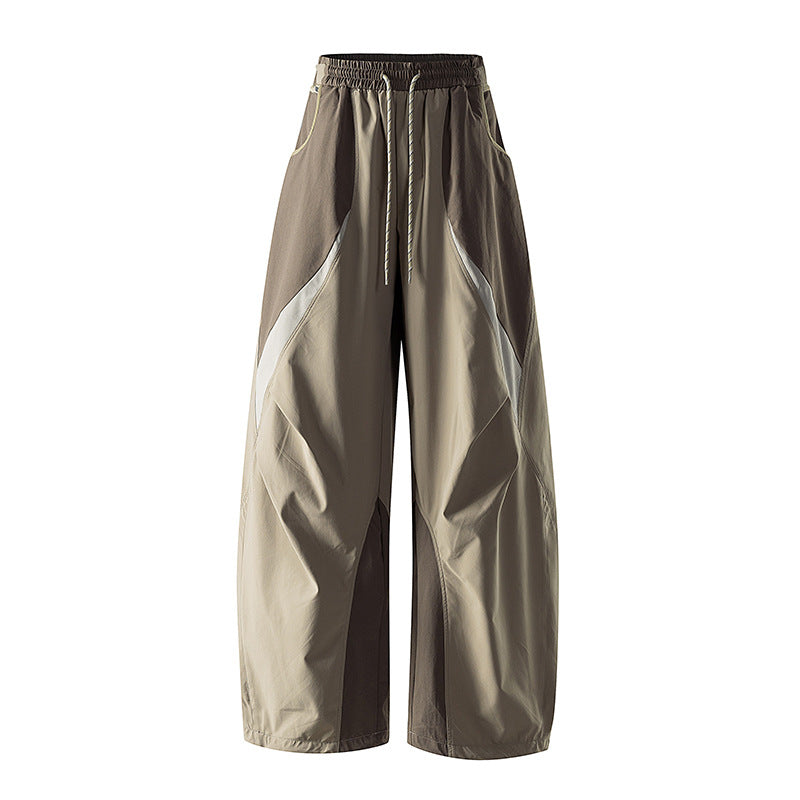 Women's wide technical balloon pants with drawstring waistband and insert panels