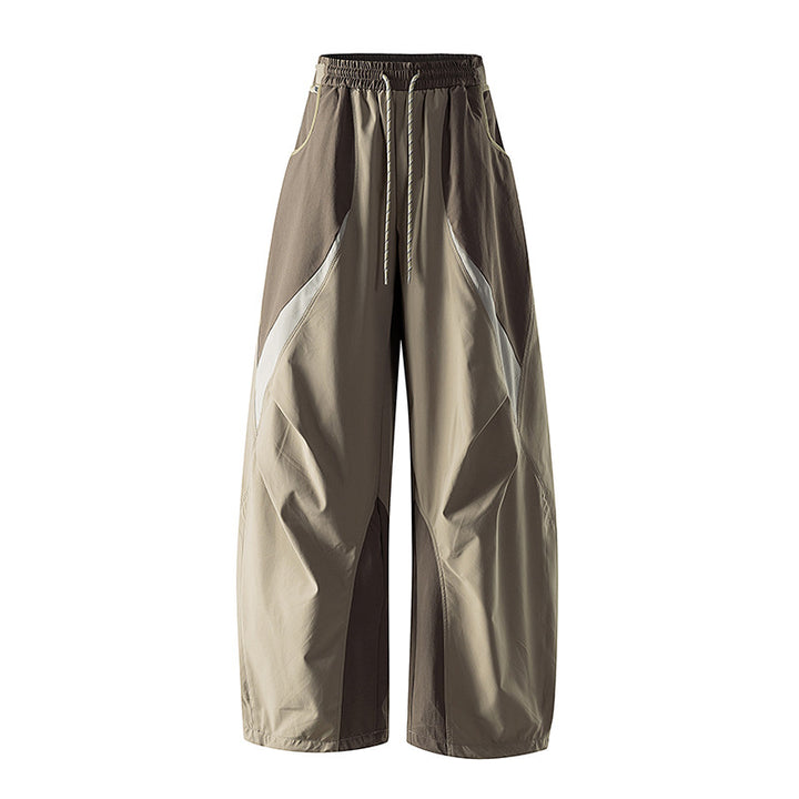 Women's wide technical balloon pants with drawstring waistband and insert panels
