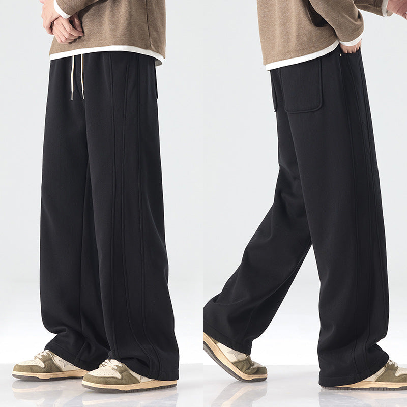 Men's loose sweatpants with decorative seam piping and drawstring