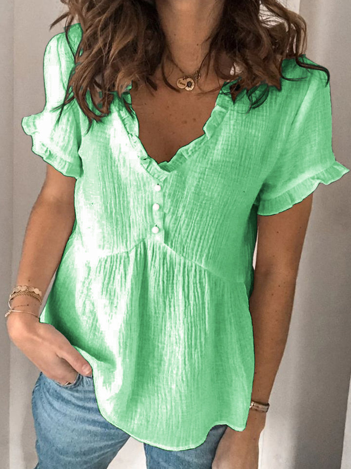 Ladies V-neck blouse with ruffle details and button closure Mune Fashion