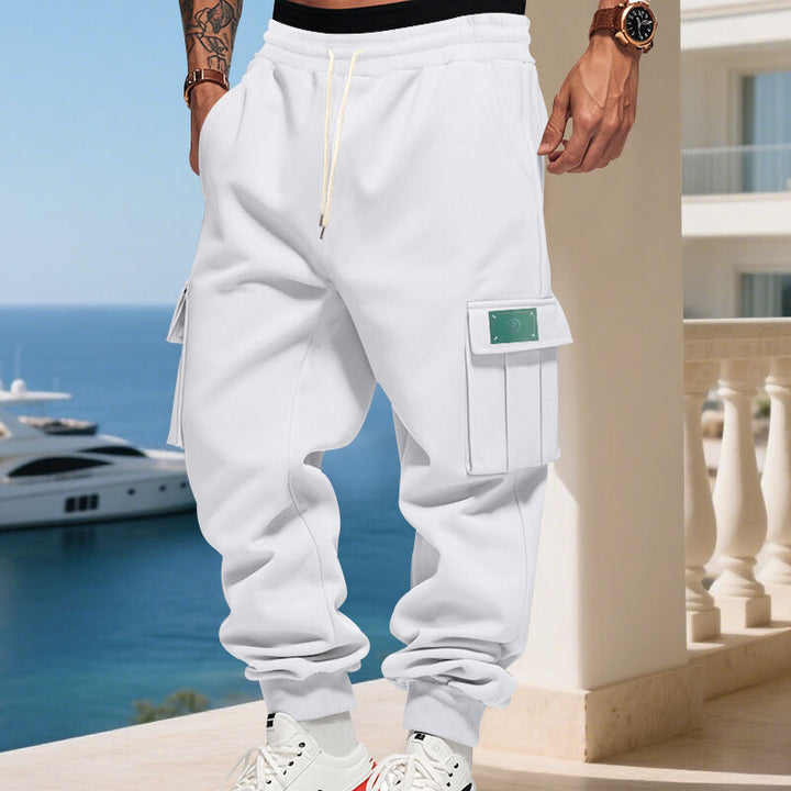 Men's Cargo Jogging Pants with generous flap pockets, elastic waistband, and ribbed hem Mune Fashion