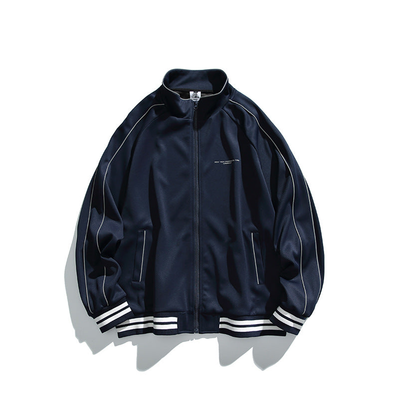 Unisex Sportive Track Jacket in oversized cut with stand-up collar, contrast piping and ribbed cuffs Mune Fashion