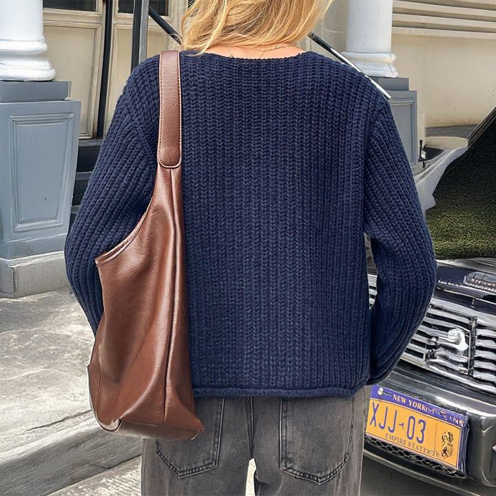Women’s short-cut textured knit cardigan with large gold buttons and patch pockets Mune Fashion