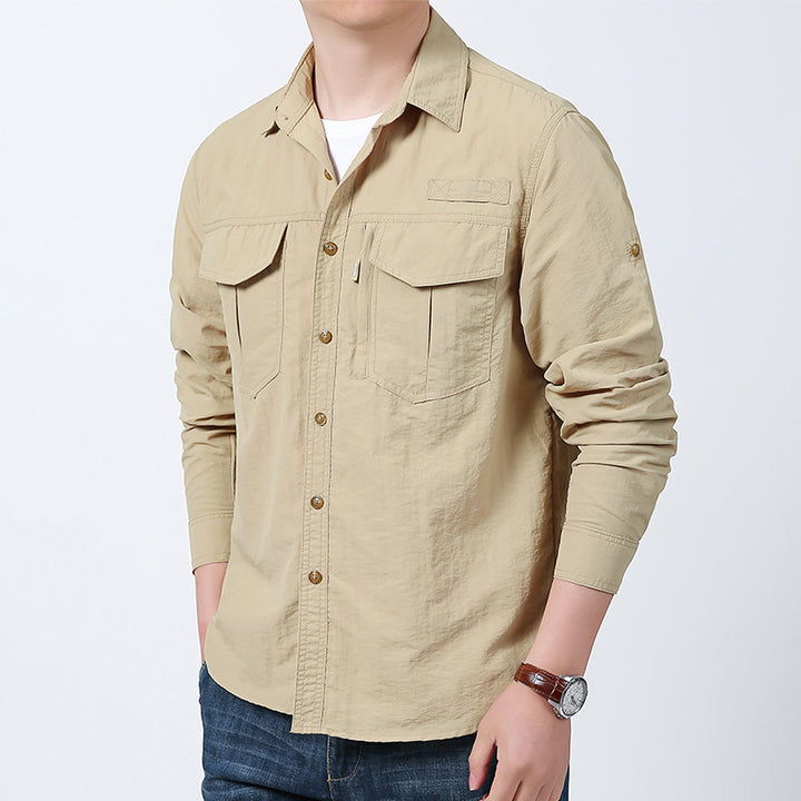 Men's long-sleeved field shirt made of lightweight ripstop with multifunctional chest pockets and concealed zip.