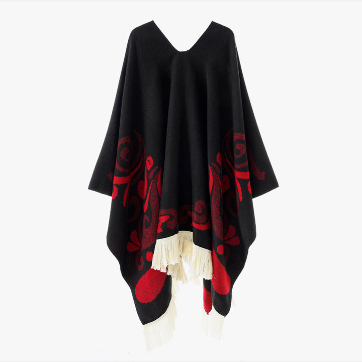 Women's wool blend poncho in cape style with V-neck, contrasting ornament jacquard and fringes.
