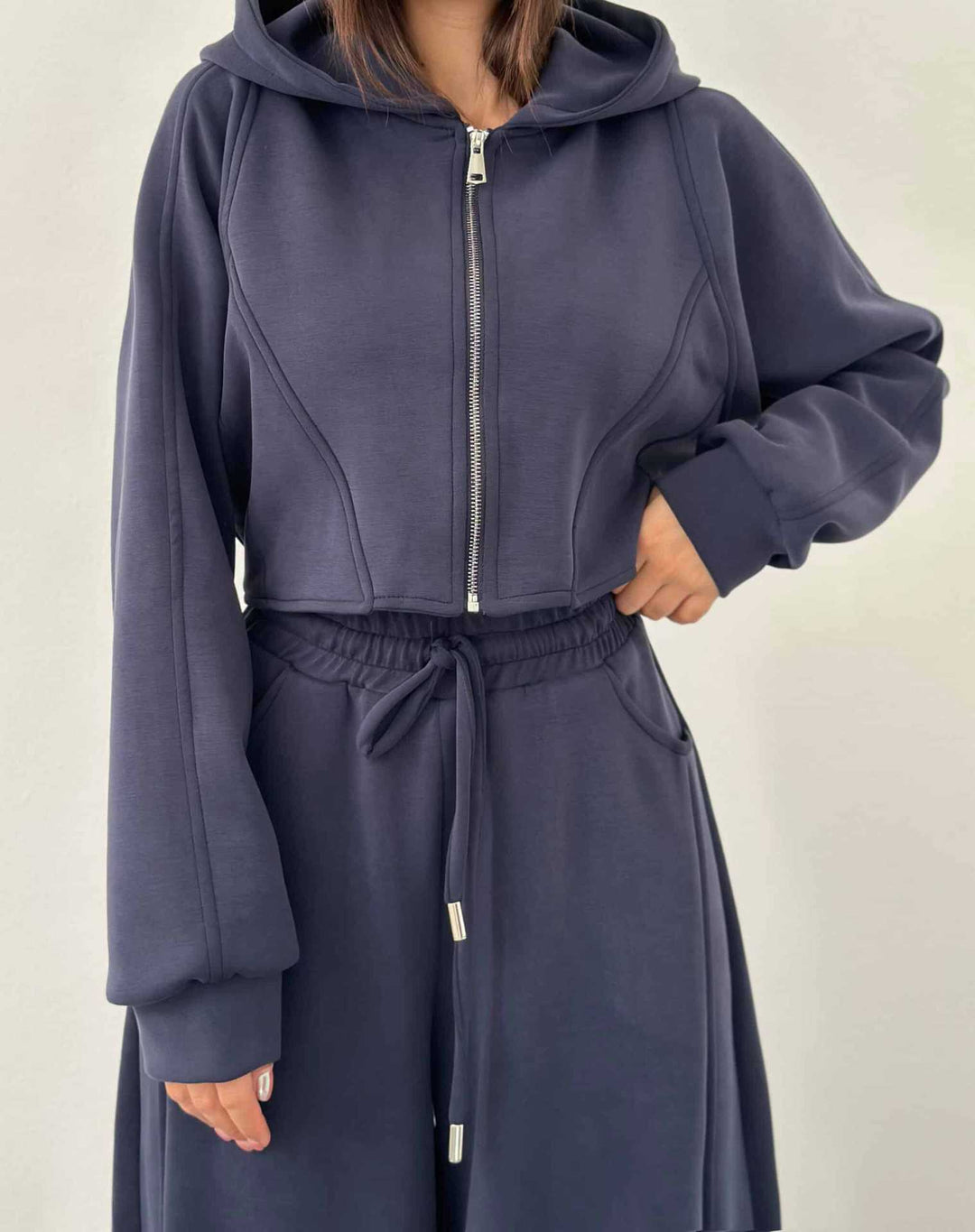Women's loose high-waist lounge pants with drawstring, side pockets, and decorative seams Mune Fashion