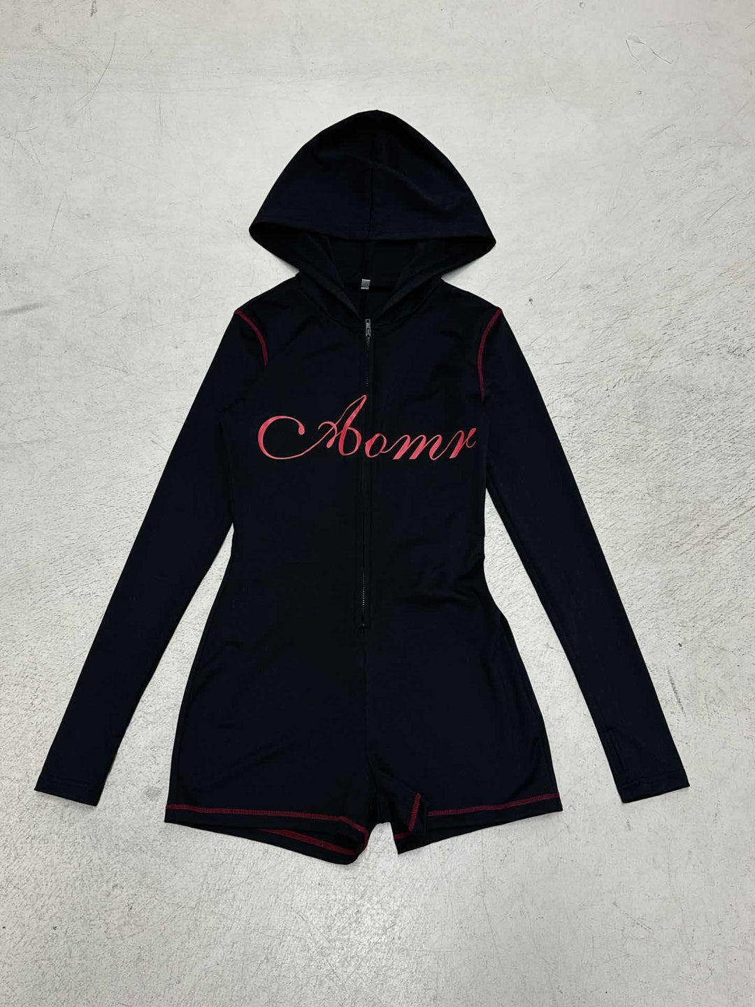 Women's tailored zip romper with hood, long sleeve design and integrated shorts made of functional stretch Mune Fashion