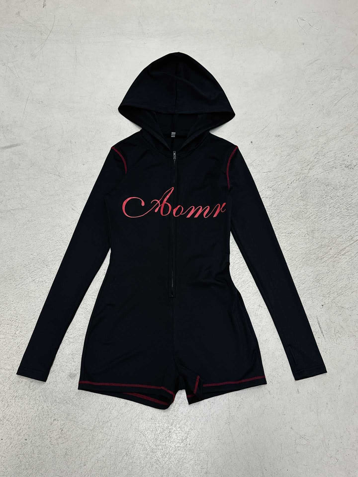 Women's tailored zip romper with hood, long sleeve design and integrated shorts made of functional stretch Mune Fashion