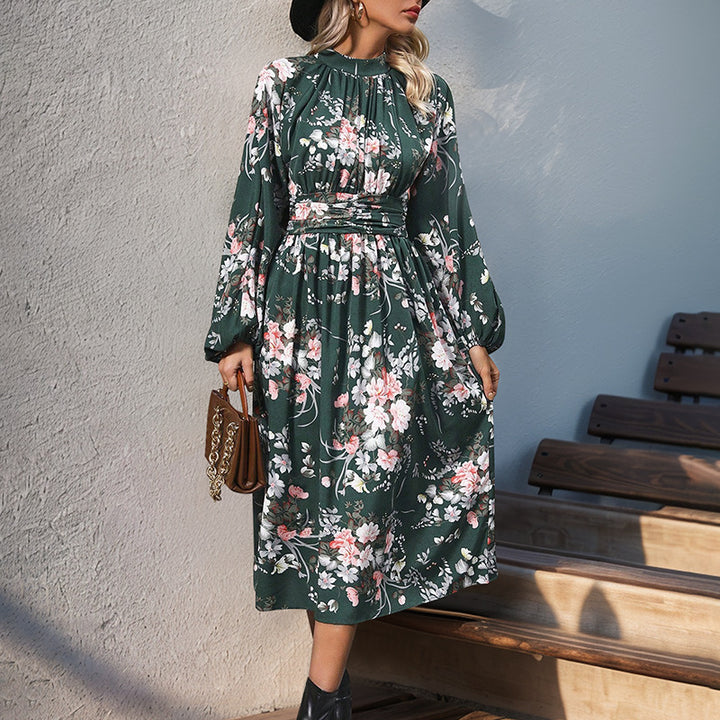 Women's midi dress with floral all-over print, stand collar and draped waist belt.