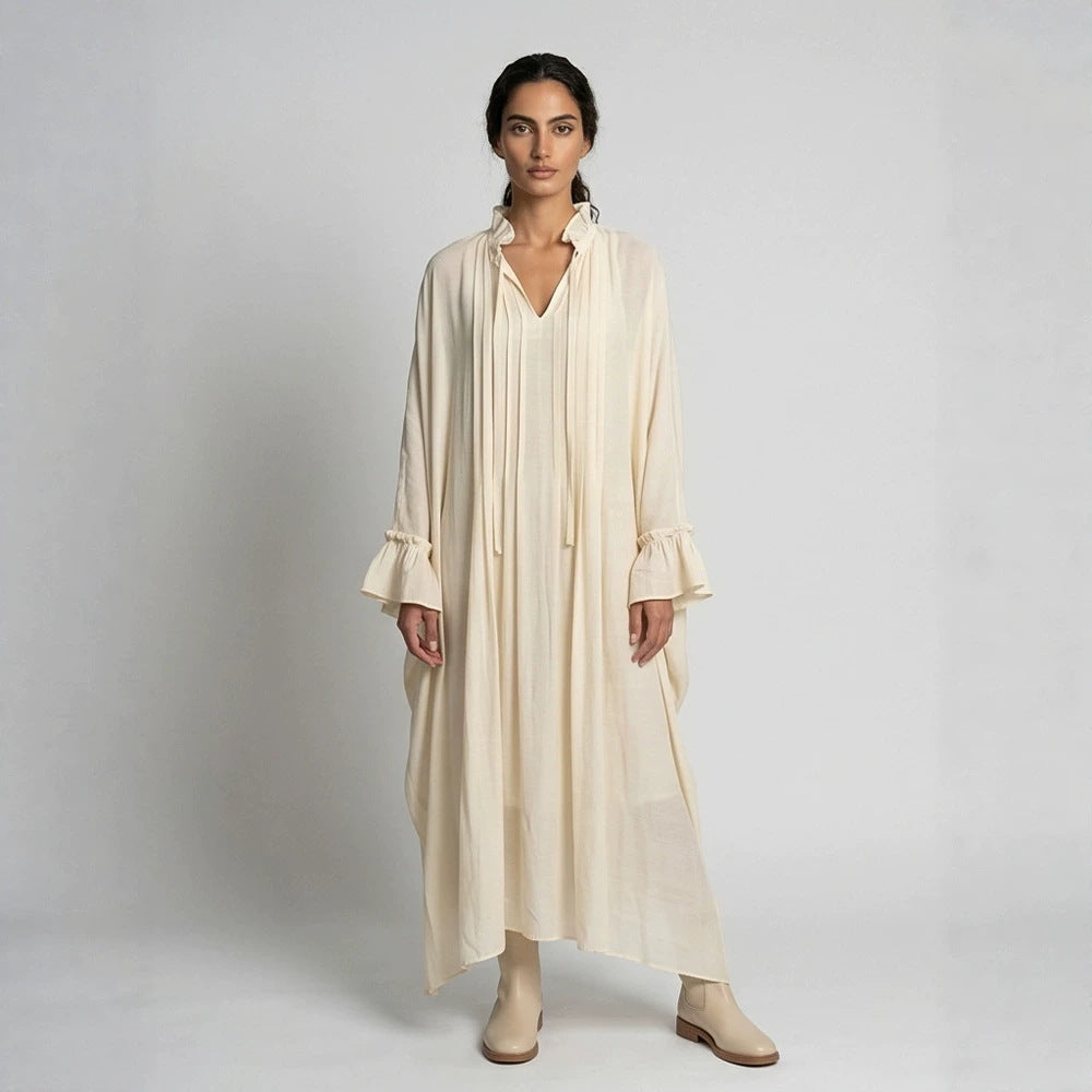 Women's maxi dress in kaftan style with ruffled collar, tie straps, and voluminous sleeves Mune Fashion