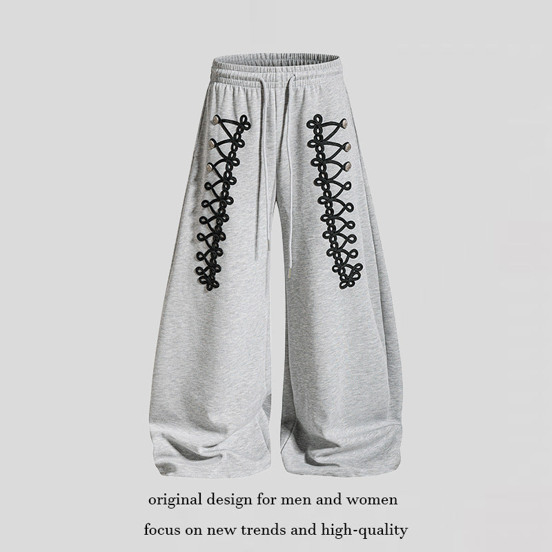 Women's loose jogging pants with elastic waistband and decorative lacing Mune Fashion