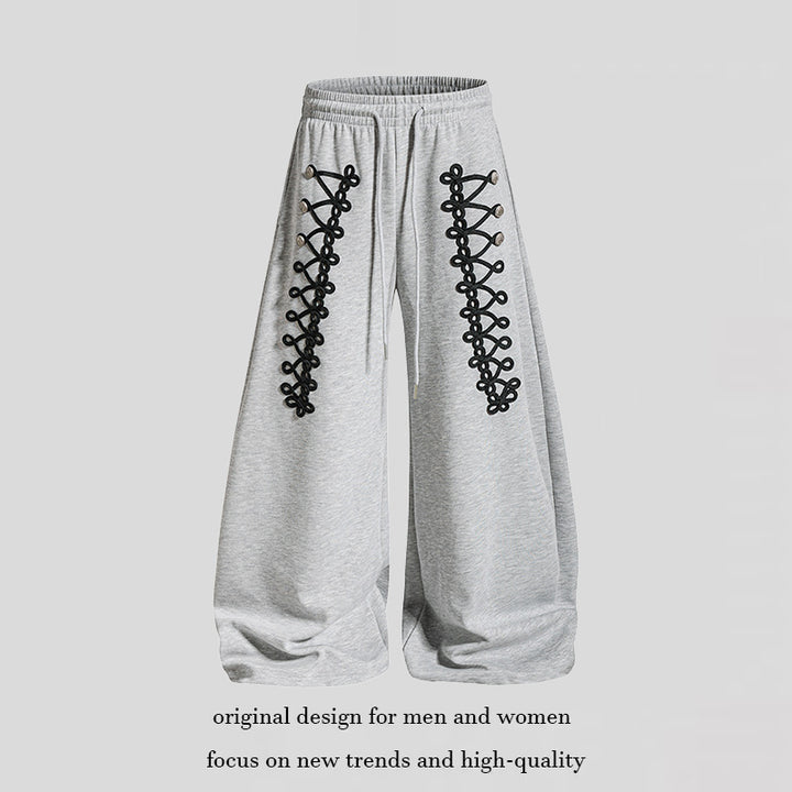 Women's loose jogging pants with elastic waistband and decorative lacing Mune Fashion