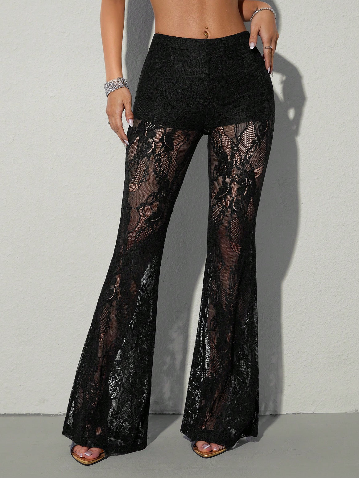 Women high-waisted lace flared pants with opaque inner shorts and floral transparent inserts Mune Fashion