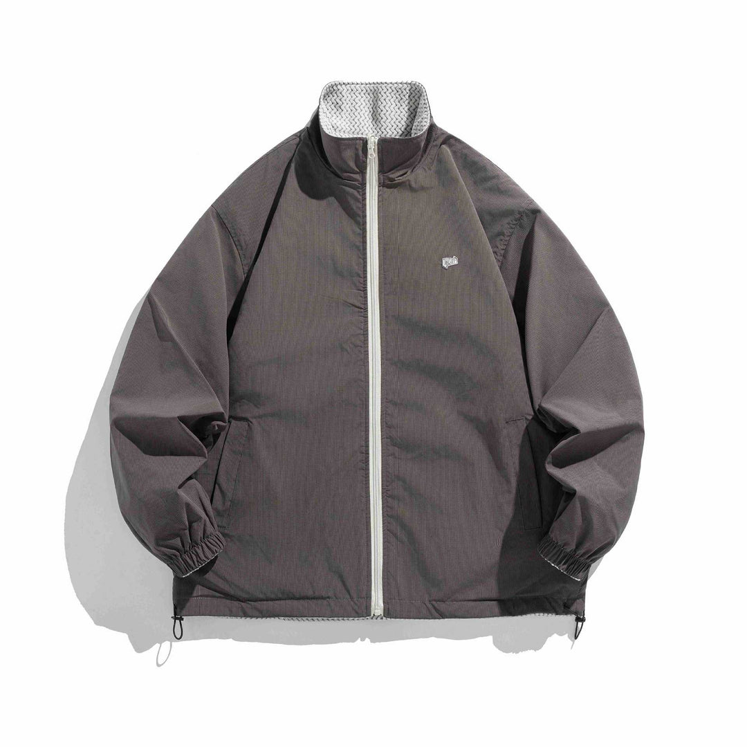 Unisex structure fleece jacket with high stand-up collar, zip pockets and drawstring hem Mune Fashion