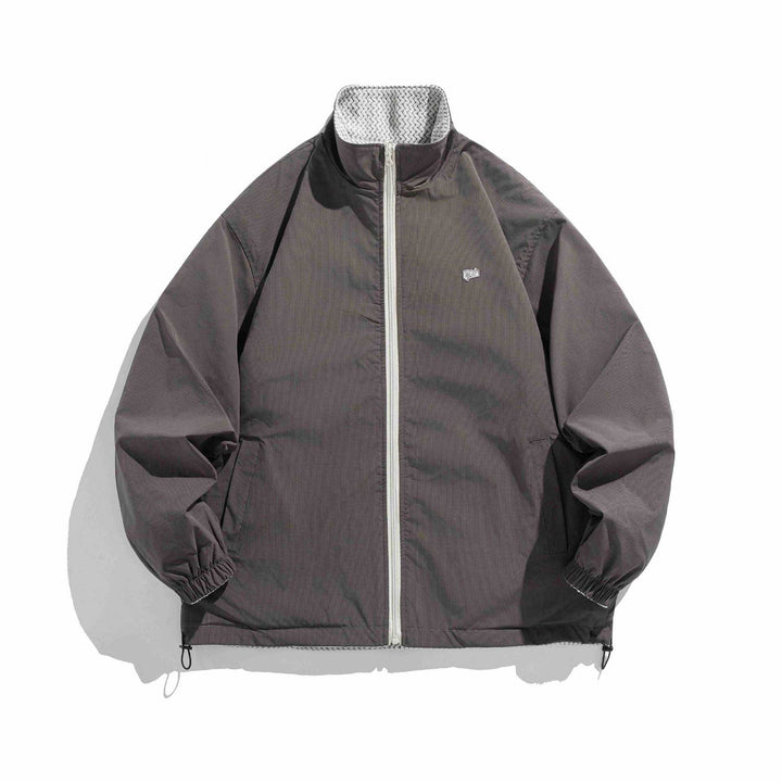 Unisex structure fleece jacket with high stand-up collar, zip pockets and drawstring hem Mune Fashion