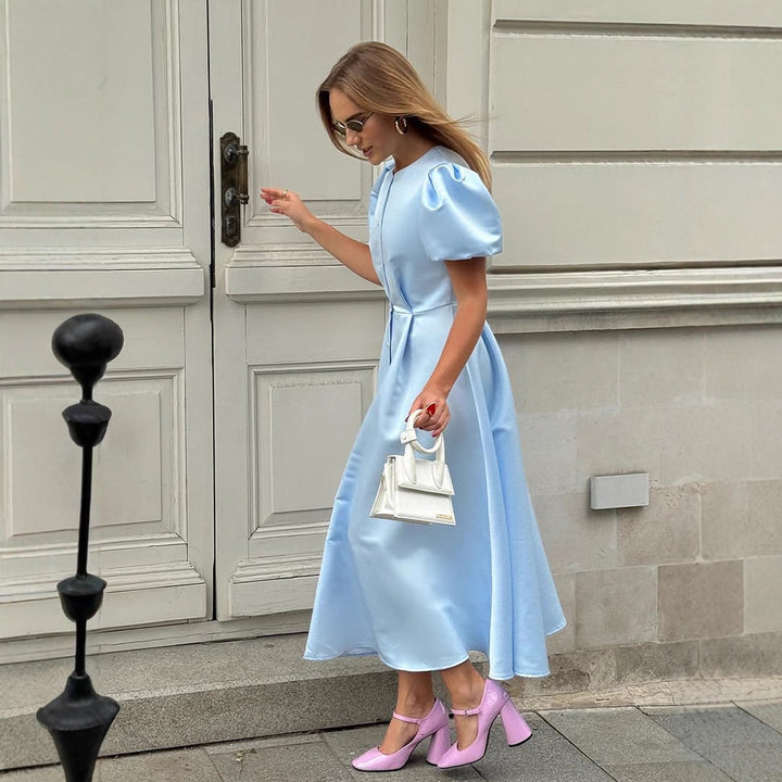 Ladies' midi dress made of satin with voluminous puff sleeves, fitted A-line and continuous button placket Mune Fashion
