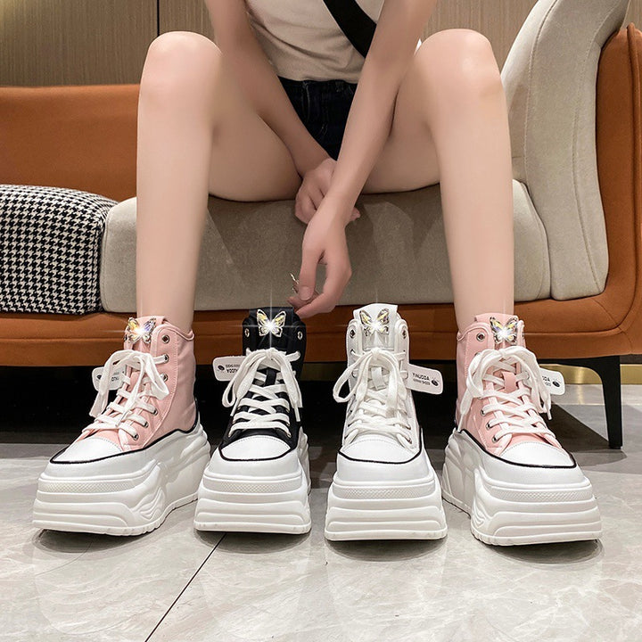 Ladies' platform sneakers with high shaft, lacing, and butterfly brooch Mune Fashion