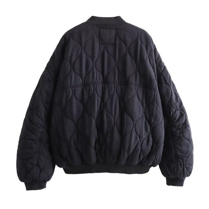 Women's quilted bomber jacket with oversized silhouette, ribbed cuffs, and flap pockets Mune Fashion