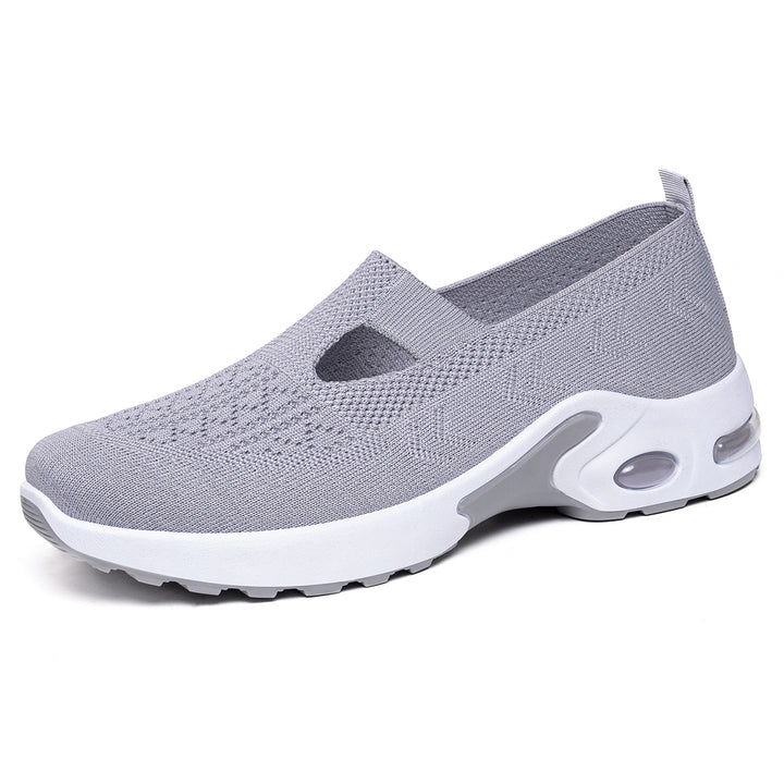 Women’s knitted slip-on sports slipper with elastic entry, cut-out detail, and visible air cushioning Mune Fashion
