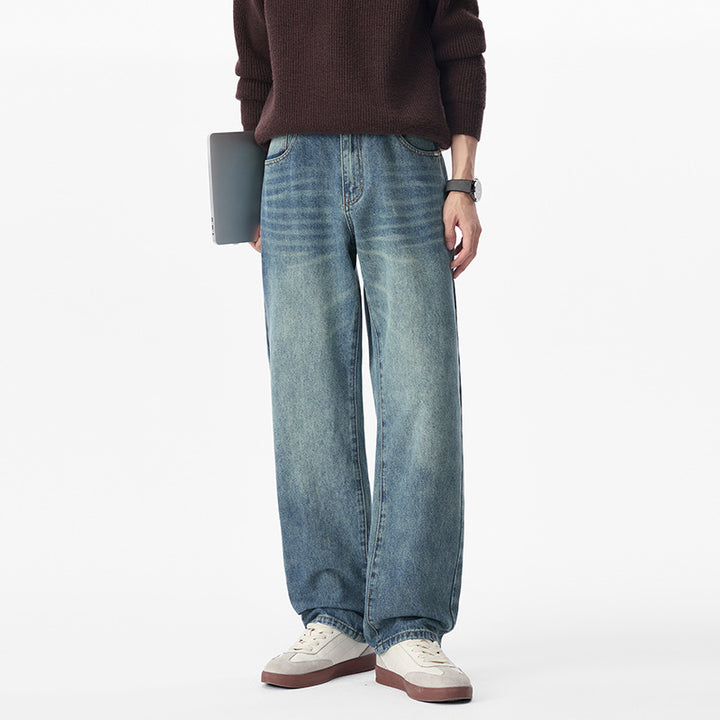 Men's baggy jeans made of heavy denim with a light used finish and a low crotch.