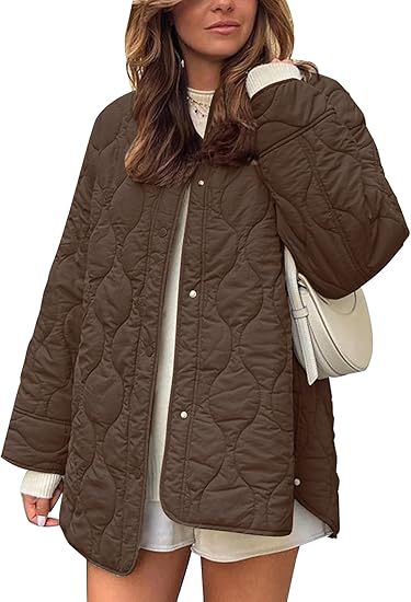 Women's quilted jacket in oversized design with curved quilting and side slit Mune Fashion