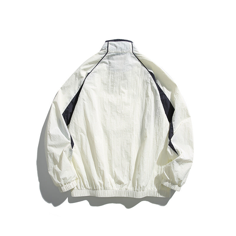 Unisex Lightweight Boxy Hooded Jacket in Windbreaker Style with Contrast Panels and Raglan Sleeves Mune Fashion