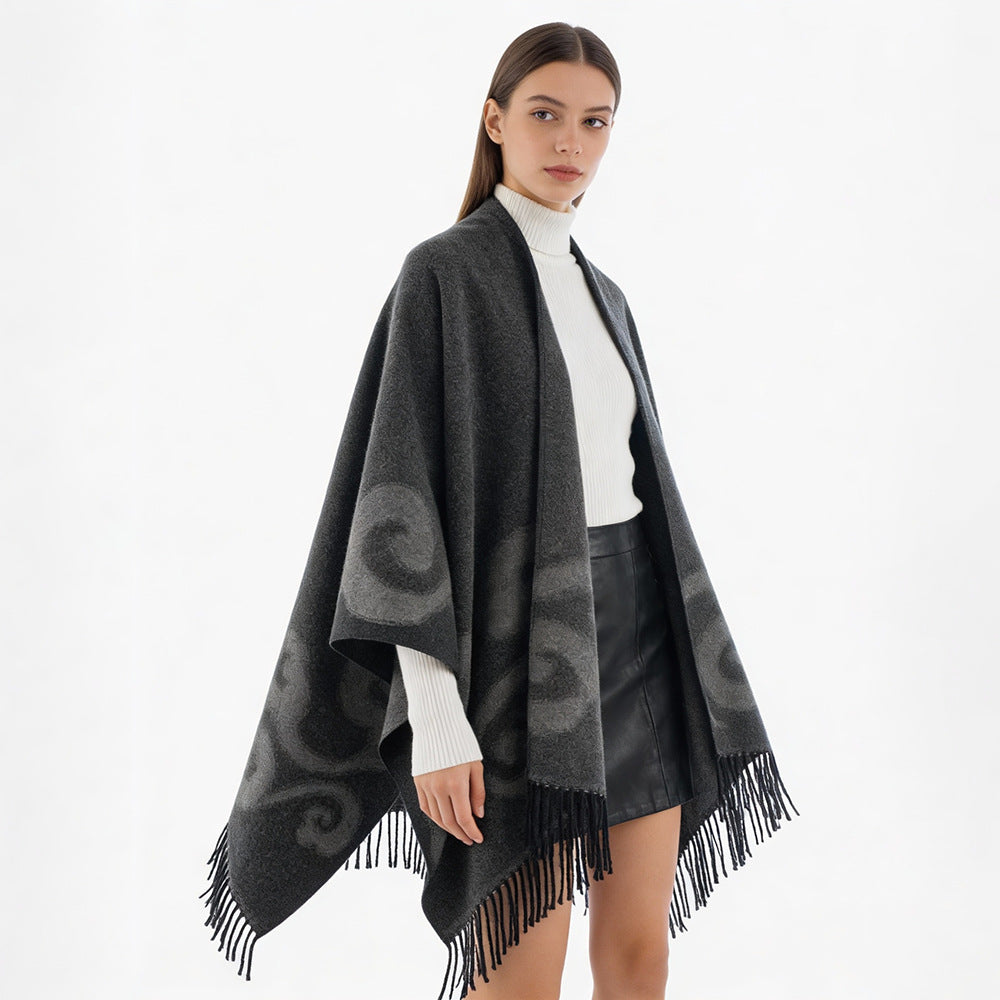 Women's wool blend poncho with jacquard swirl pattern, V-neck and fringes