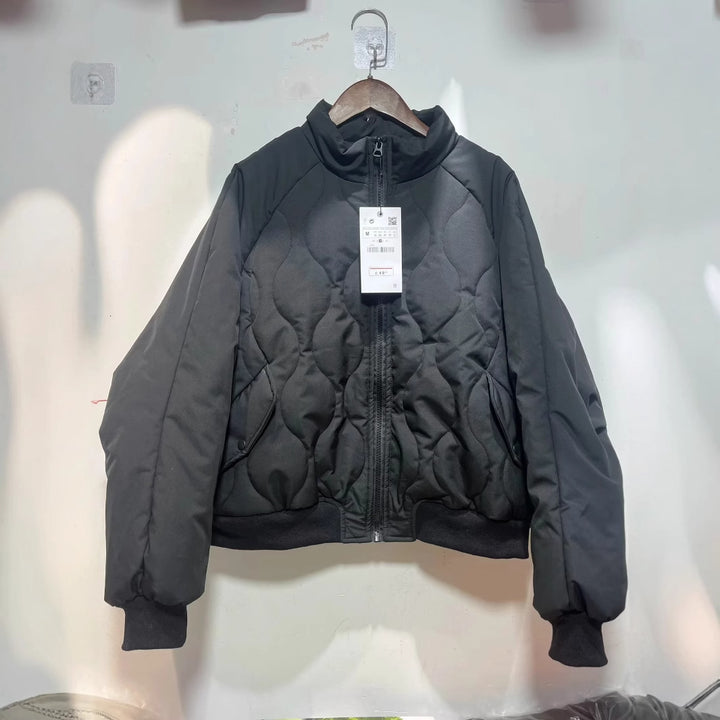 Women's quilted bomber jacket with high stand-up collar, lightweight thermal padding, and ribbed cuffs Mune Fashion