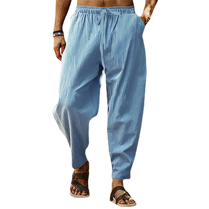 Men's lightweight harem pants in linen look with elastic drawstring waistband, side pockets, and tapered ankle cuffs Mune Fashion