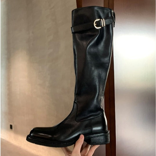 Ladies knee-high leather boots with flat profile sole and decorative strap Mune Fashion