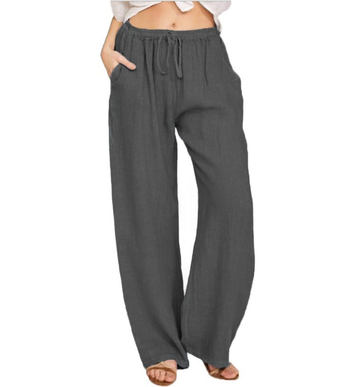 Women's airy palazzo pants with drawstring waistband, elastic waist finish, and side pockets Mune Fashion