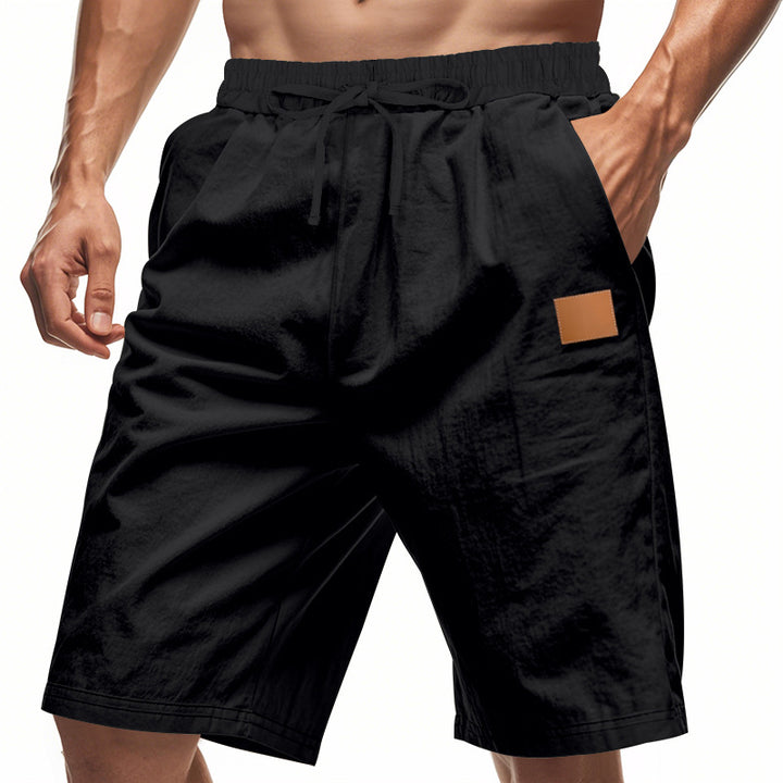 Men's lightweight casual Bermuda shorts with elastic waistband, drawstring and discreet leather application Mune Fashion