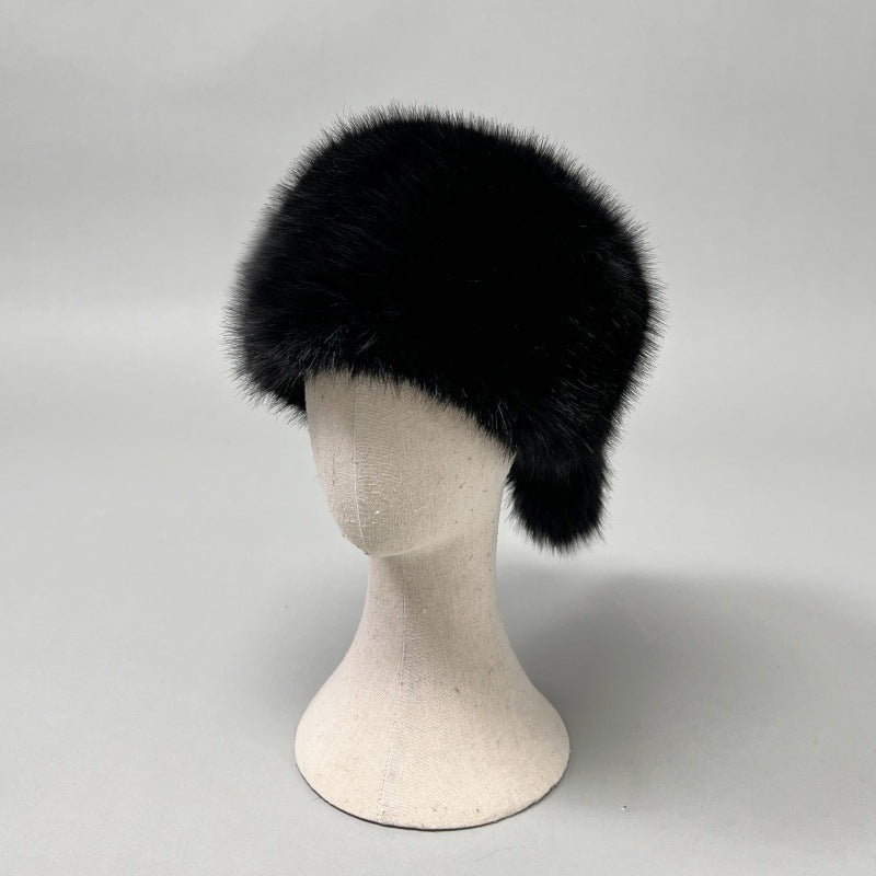 Women’s plush faux fur trapper hat with earflaps and decorative tail Mune Fashion