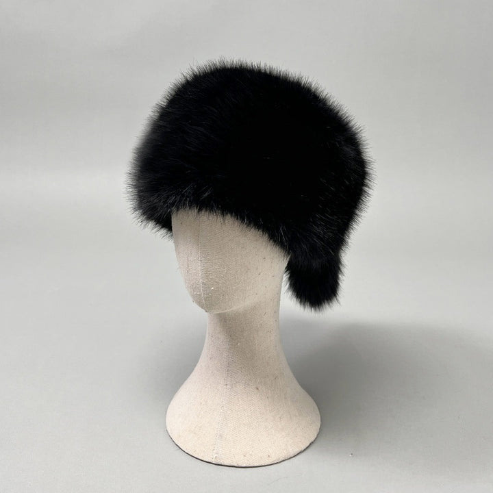 Women’s plush faux fur trapper hat with earflaps and decorative tail Mune Fashion