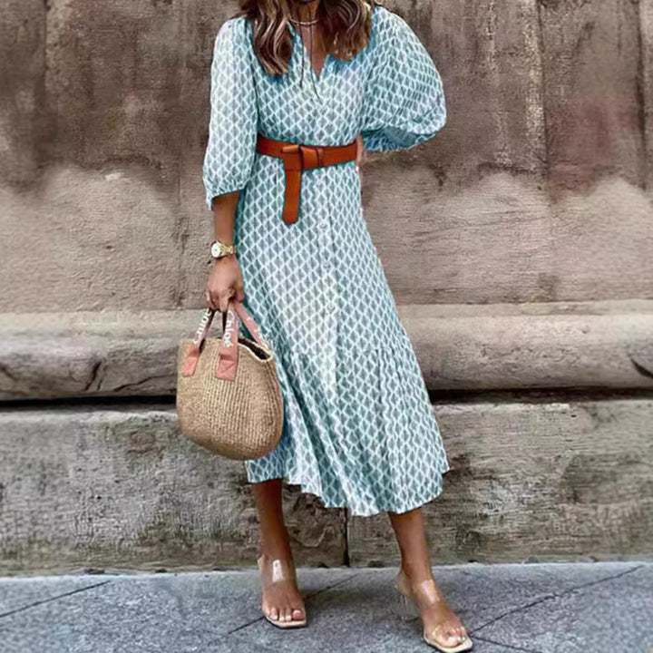 Women's lightweight patterned midi dress with V-neck, button placket, tiered skirt, and balloon sleeves Mune Fashion