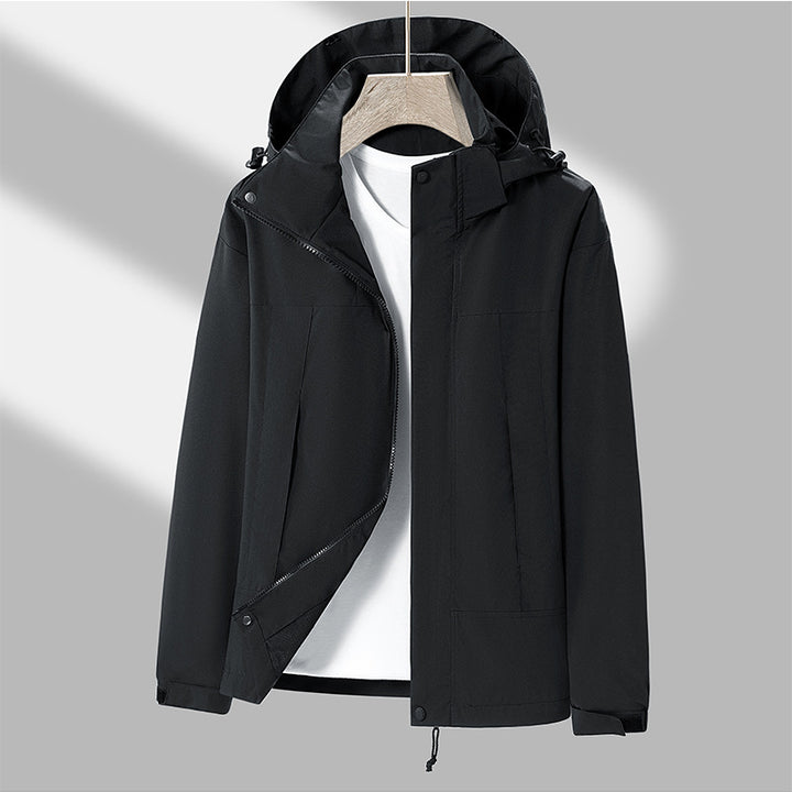 Men's lightweight softshell jacket with contrasting shoulder panel, adjustable hood, and Velcro cuffs Mune Fashion