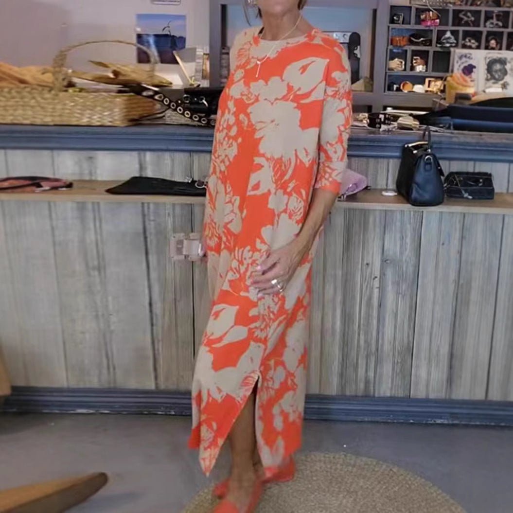 Women’s flowing A-line maxi dress with three-quarter sleeves round neckline side slit and inserted pockets Mune Fashion