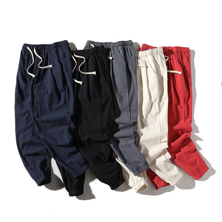 Men's loose joggers with elastic waistband, drawstring, side pockets, and elastic cuffs Mune Fashion