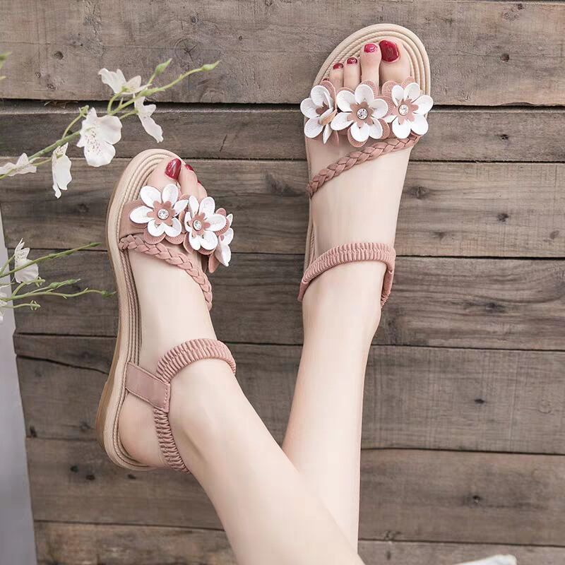 Women's playful strap sandal with braided decorative bands, flower appliqués, and elastic heel strap Mune Fashion