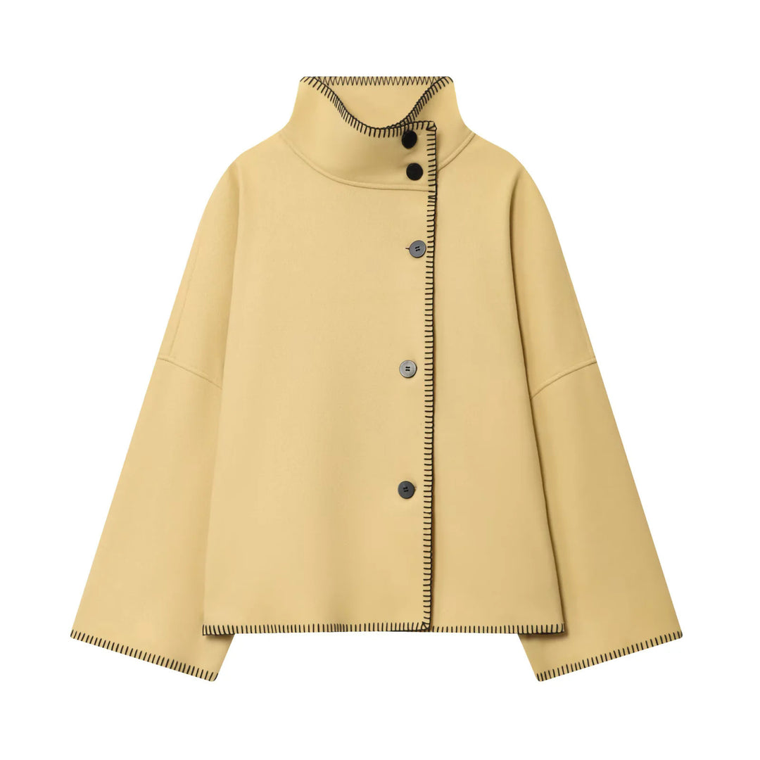 Ladies oversized wool cape jacket with high collar and asymmetrical button placket Mune Fashion