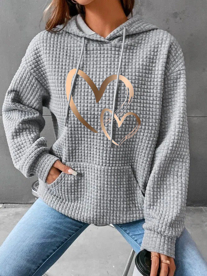 Women's hooded sweatshirt with waffle structure, kangaroo pocket and metallic heart print Mune Fashion