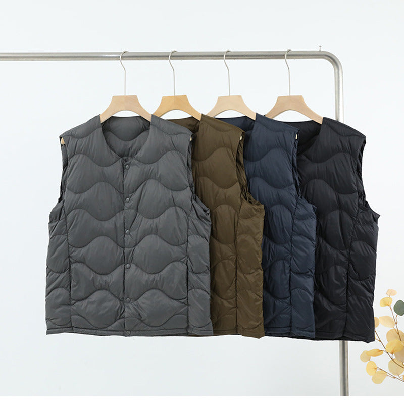 Women’s sleeveless thermal quilted vest with wave-shaped quilting and snap button closure Mune Fashion