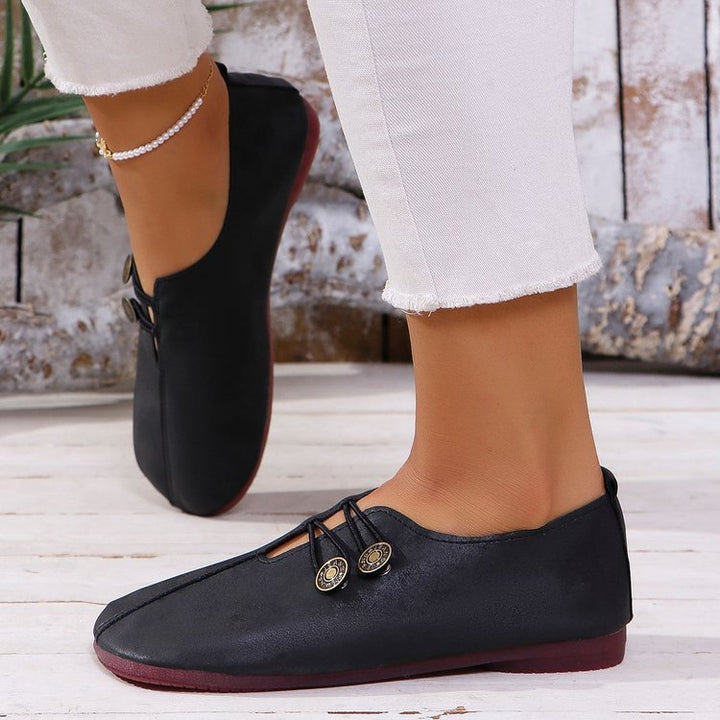 Ladies nan elegant comfort slipper in moccasin style with elastic decorative cord and button detail Mune Fashion