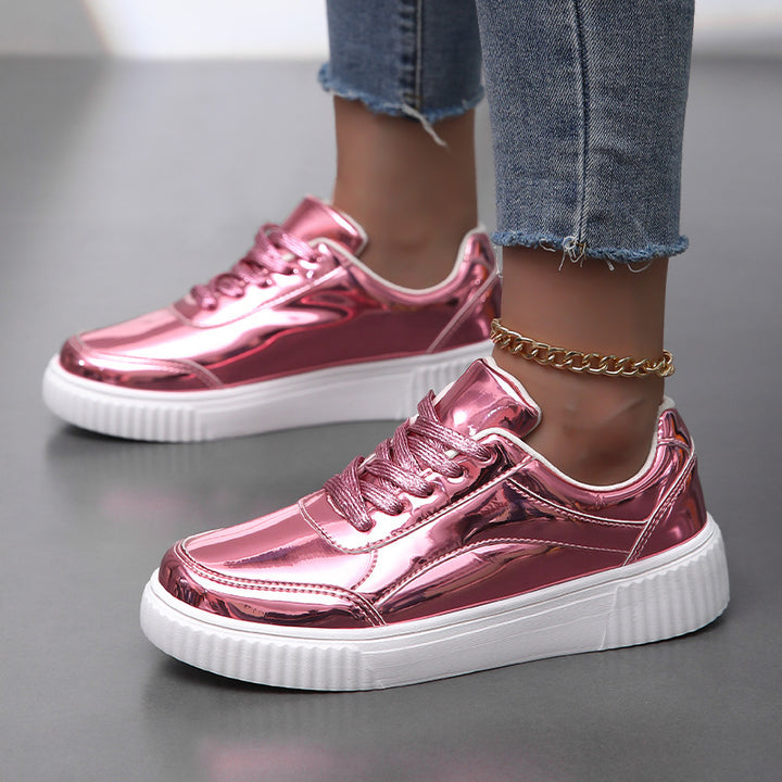 Ladies' low-cut sneakers with reflective patent upper, padded shaft, and raised outsole with groove profile Mune Fashion