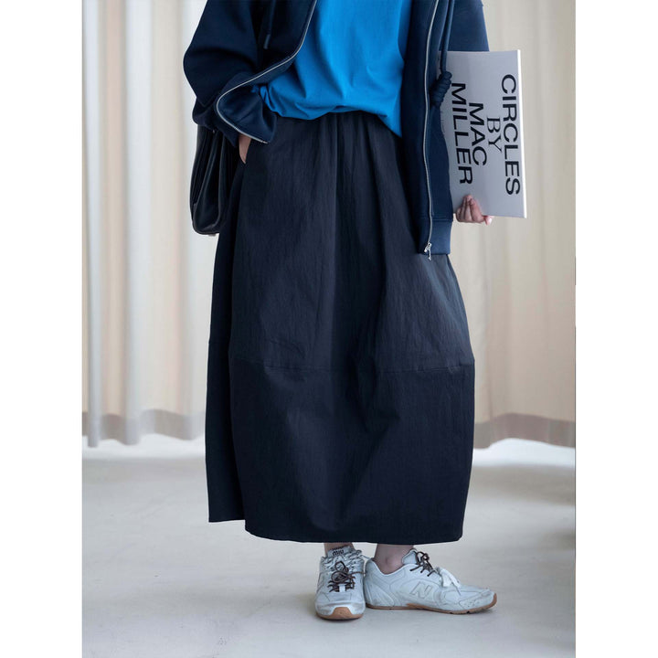 Women's midi skirt with high elastic waistband, flowing wide design and practical side pockets Mune Fashion
