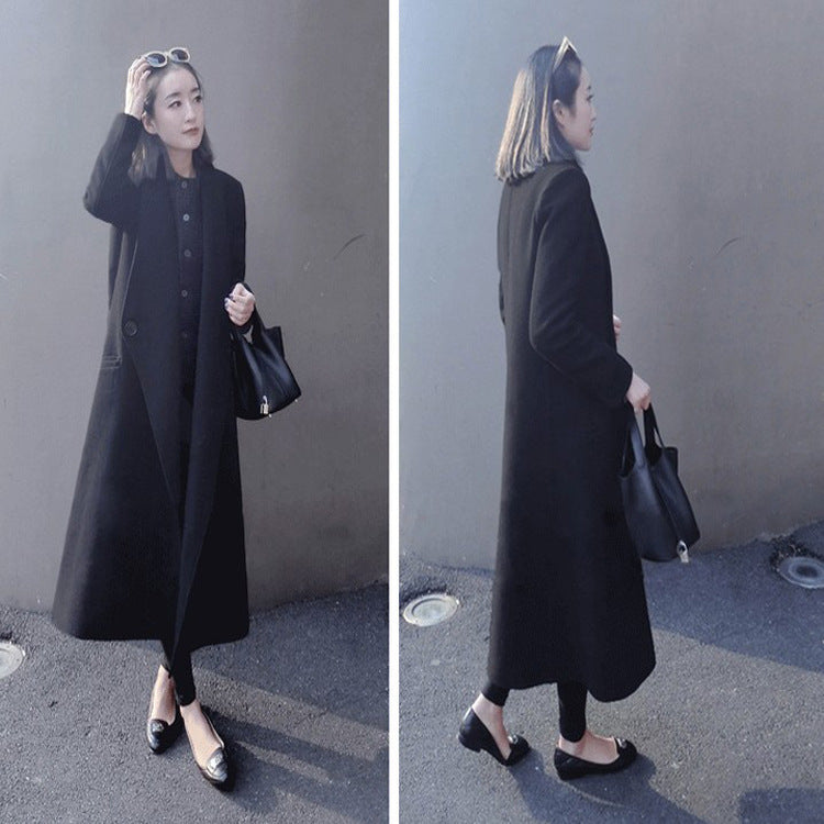 Women's midi-length tailored wool blend long coat with shawl collar, inset pockets, and discreet decorative buttons Mune Fashion