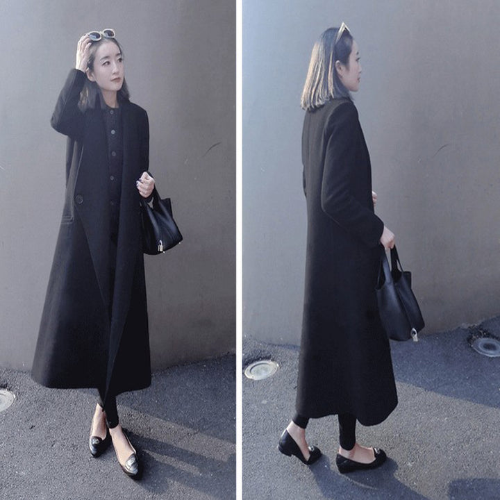 Women's midi-length tailored wool blend long coat with shawl collar, inset pockets, and discreet decorative buttons Mune Fashion