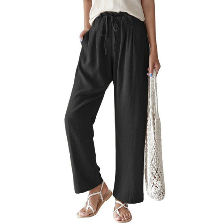 Ladies casual linen pants with wide legs, elastic waistband and side pockets Mune Fashion