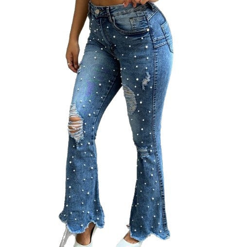 Ladies pearl-embellished high-waist flared jeans with destroyed details and raw hem Mune Fashion