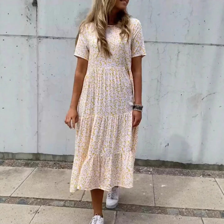Women's flowing tiered maxi dress in Boho babydoll style with gathered underbust and short sleeves Mune Fashion